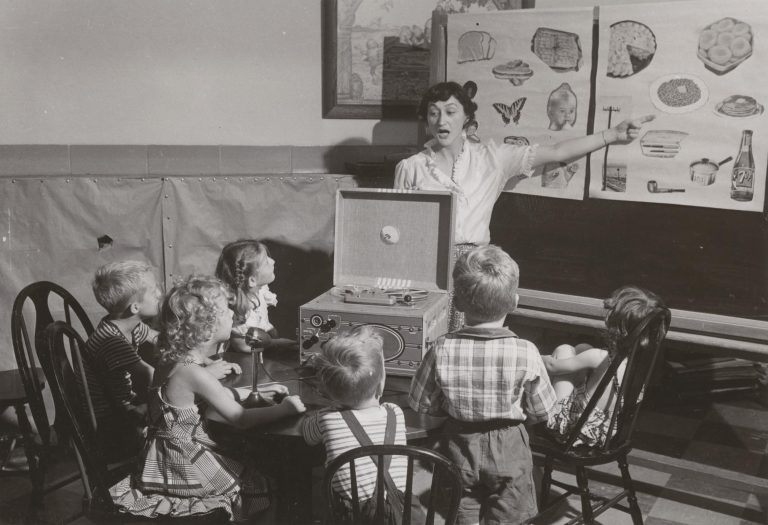 "A woman teaches a class of small children at the summer Nursery School at the University of Wisconsin-Madison."