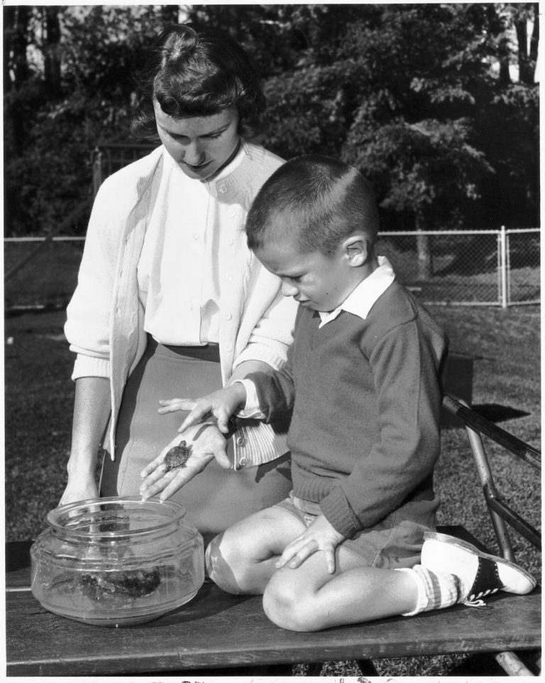 A home economics student with a young child."